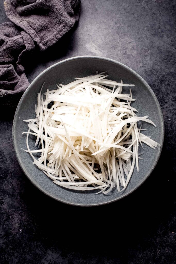 Daikon radish peeled into thin strips. 